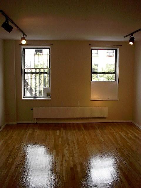 Spacious Renovated Studio with HIGH Ceilings, Beautifully polished wood floors, Great Renovated Kitchen, and Immaculate Bathroom!