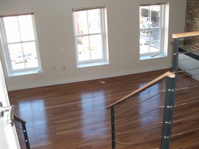 This unit has 200 year old brick walls, a skylight, sunken living room, Brooklyn Bridge views, a bedroom large enough for a king bed, armoire and entertainment center; plus stainless appliances in the