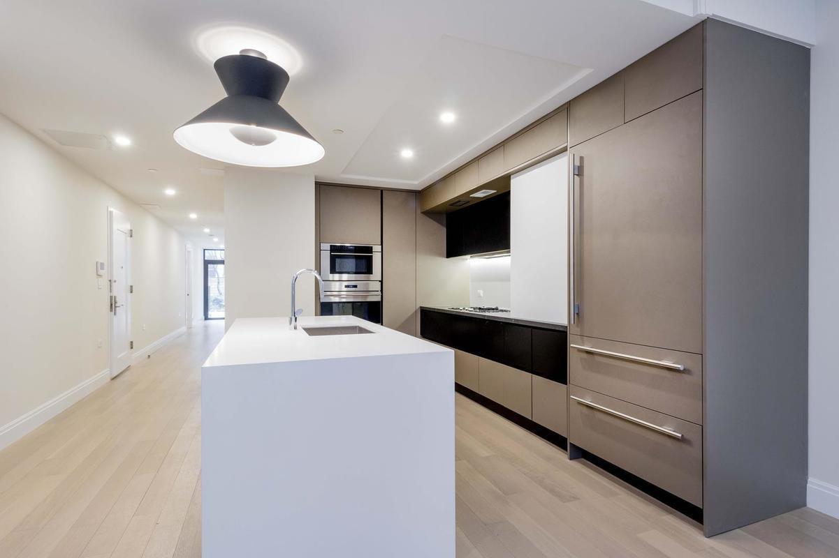 318 81st St E 1 New York, New York Welcome to 318 East 81st, a new boutique collection of two and three bedroom full-floor condominium residences and a part time doorman.This ground floor duplex residence features two bedrooms, two-and-a-half bathrooms and is complete with an expansive 1054 square foot private garden, accessed from both floors.The lower level has a large recreation room with lots of natural light, half bath, washer/dryer and access to outdoor space with stairs up to the private garden.A collaboration with the Italian artisan brand Pedini, the kitchen is carefully crafted and outfitted with rich Petra Grigio quartz back¬splashes and countertops, and Absolute Blanc peninsula countertops by Vadara. The state-of-the-art appliances include: refrigerators by Sub-Zero; cooktops and dish¬washers by Miele; ovens, hood by Miele and microwave by Wolf; wine coolers by Summit; and washers and dryers by Bosch.A spa-like experience, the master bathrooms feature radiant floor heating, Arabescato marble walls and Vadara Absolute Blanc quartz vanities. The design of secondary bathrooms is complimentary to that of the master bath sanctuaries with honed porcelain flooring and silver travertine walls. All bathtubs and showers are by Kohler with fixtures by Duravit. The powder rooms feature dark grey honed walls and Vadara Absolute Blanc vanities.Inspired by iconic California modernism, the boutique collection of six full-floor condominium residences at 318 East 81st Street includes a part-time doorman and combines the openness of loft-like living with quintessential Upper East Side graciousness. Designed by internationally-acclaimed architect Andres Escobar, this rarefied address offers privacy, indoor and outdoor living, meticulous craftsmanship, and a rich, yet elegantly understated palette of materials.