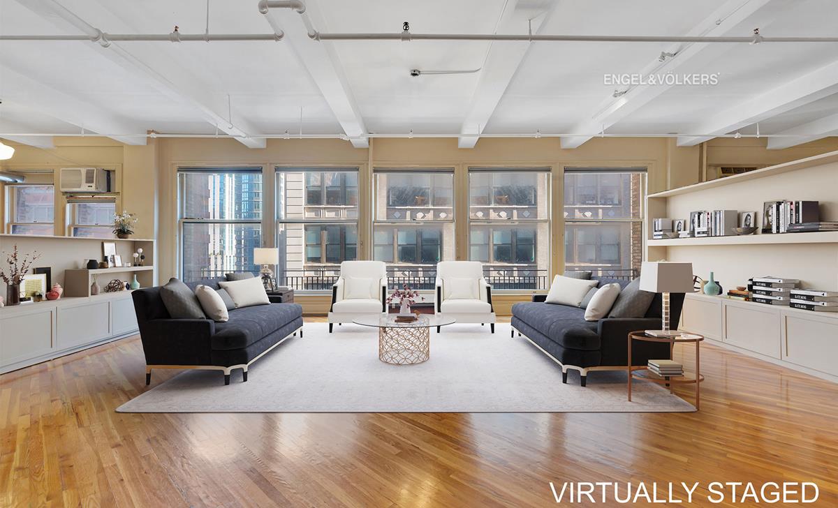 38 26th St W 8 New York, New York BROBDINGNAGIAN LOFT IN THE HEART OF NOMADEPIC, MEGA, COLOSSAL, ENORMOUS, MAMMOTH, GARGANTUAN, VAST, MASSIVE, HERCULEAN LOFT HOME. ALL THE SPACE YOU HAVE EVER DESIRED
. DID WE SAY ITS REALLY BIG?THE BUILDING:38 WEST 26TH STREET is the ultimate in classic and private loft living. With its architecturally significant limestone facade, the building enjoys close proximity to all that NoMad has to offer. Adjacent to Madison Square Park and central to the hippest shopping, entertainment, culture and dining the city has to offer. Pick up all your supplies within a few minutes to Whole Foods, Fairway and Home Depot. Stroll over to the Highline just a 10 min walk away. An uncharacteristically low maintenance of $4,248 is icing on the cake. THE APARTMENTAs you arrive on the 8th floor to your completely private landing you will be welcomed with an immediate sense of the grand space that awaits. An oversized closet and storage within the private landing provide space for all four seasons of coats shoes and things you just dont know where to keep.Take one step beyond the landing to the great room and the 55+ linear feet of North facing windows will greet you with lovely abundant natural light. The 11.25 ft. high ceiling adds to the drama of the approximately 5,000+ square foot space with four exposures. The North wing of this full floor loft is configured as your public and entertaining spaces. Currently with a semi-open floor plan, the possibilities for an alternative layout are endless. A delightful eat-in country kitchen provides ample dining space for four. Adjoining the kitchen is your 25 X 16.5 ft. dining room has enough proper dining space for your 30 closest friends. Adjoining the dining room is a full 17.2 X 17 den and T.V. room with North and East exposures. Next you come upon the heart of the space which is presently a large office area, approximately 22 X 16 ft. with more than enough room for 2 oversized executive desks, an administrative desk, conference lounge seating. All the walls are lined with elegant bookshelves. This office area nicely delineates the public areas of the north wing from the private south wing areas with its 5 grand bedrooms and additional living room den area. From the center of the floor you arrive at the south wing of this private floor. The double wide hallway that leads down the loft provides terrific gallery walls to exhibit multiple collections of your favorite art work. The South wing provides no less than five master sized bedrooms and 3 full bathrooms. It just gets better! On this South wing you have yet another approximately 18 x 18 foot living room/ entertaining area with extra galley kitchen and wet bar. There is a washer and dryer in the loft. Closets galore. With some TLC you can create your ultimate dream home.