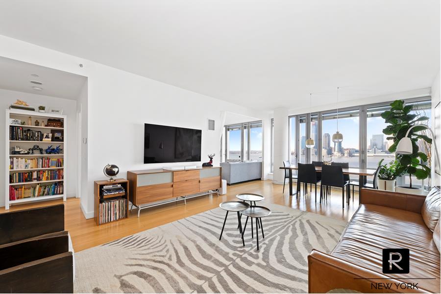 2 River Ter 10-T New York, New York UNOBSTRUCTED WATER VIEWS. Perched above Rockeller Park and the Hudson River, this Riverhouse home enjoys breathtaking views as far as the eye can see. Originally delivered as a 3 bedroom, the current owner has opened up the third bedroom to create an expansive living/dining room with wall to wall, floor to ceiling windows and open kitchen. The current layout can easily reversed should you want the third bedroom closed to the living room. The David Rockwell designed kitchen includes large windows, custom Italian cabinetry by Schiffini, Corian countertops, and energy star appliances by Sub-Zero, Thermador and Miele. The west facing master bedroom has two large closets and an en-suite bathroom with a double sink vanity, frameless glass shower, separate Neptune soaking tub and honed-finish travertine. There is a second well-proportioned bedroom with expansive closets and en-suite bathroom, a windowed study and powder room. This floor-through loft-like home enjoys morning and afternoon sunlight due to the East and West exposures and features Bamboo flooring through-out. Filtered air and water, Bosch washer and dryer and multi-zone thermostat controls complete this home. ***10T is located in the West wing of the Riverhouse, the only LEED Certified Green Condominium in North Battery Park / West Tribeca. Entered through the more private and intimate west lobby, residents also enjoy having only three apartments per floor.***The Riverhouse is situated in front of Rockefeller Park greenery and the Hudson River. This full-service building is rated Gold by the Leadership in Energy and Environmental Design (LEED) program. This luxury condominium features 24-hour concierge service, on-site parking garage, 50' lap pool, fitness center, bicycle storage, billiards area, landscaped interior courtyard and outdoor terrace, media cafe, and private pet grooming area. The building is home to the Poets House, the premier independent poetry library in the United States, in addition to a branch of the New York Public Library. The Riverhouse is across the street from the Conrad Hotel, Atrio, Harry's Italian, El Vez, Shake Shack, Beans & Greens, Vestry Wines and an 11 screen movie theater. Additional location amenities include being just steps from all the fabulous Tribeca shopping, restaurants, Whole Foods supermarket and Soul Cycle. Neighboring the Riverhouse is the recently renovated Brookfield Place. The re-imagined space has gone through a $300-million renovation that now includes a 30,000-square-foot French-inspired marketplace and exclusive retail shops such as Saks, Gucci, Hermes, Ferragamo,Scoop Zegna and many more. Brookfield Place is also home to Hudson Eats, an upscale dining terrace overlooking the Hudson River featuring fast-casual food from 14 chef-driven concept restaurants such as Blue Ribbon Sushi, Del Friscos Grill, Seamore's and Parm to name a few.Contact us today to schedule a private viewing.