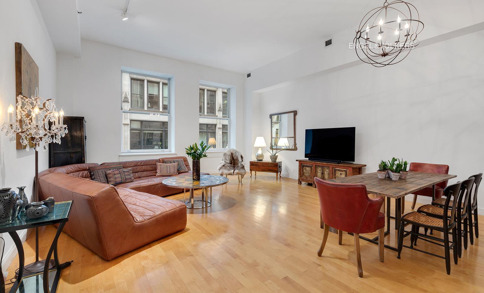 42 20th St E 2-B New York, New York Spacious Flatiron Loft in Beaux Arts CondoThere are 3 bedrooms, 2.5 bathrooms and a home office in this spacious loft in the Bullmoose Condominium, with over 2,500 SF under soaring 13 ceilings. A gracious entry foyer leads to the huge living/dining space with its oversized, north-facing Pella windows. The open kitchen features Poggenpohl cabinetry, 2" thick Carrara marble counters and matching backsplash, 5-burner Viking gas cooktop and electric oven, built-in GE Profile microwave, SubZero refrigerator and dual temperature wine cooler, Bosch dishwasher, and an Insinkerator disposal. Adjacent to the kitchen there is a large home office/den with an ample storage closet plus upper level storage along two sides of the room. The apartment's three bedrooms are located off a spacious central corridor. The generously-sized master bedroom has a very large walk-in closet and a luxurious bathroom with double vessel sinks on stone counters with wooden, mirrored Robern medicine cabinets, Toto toilet, walk-in steam shower and 6' Zuma soaking tub. The second bath and powder room have similar finishes as the master, and the 6' Zuma tub in the second bathroom also has a shower. The full-sized laundry room has a Bosch washer and vented dryer and storage space. The apartments other features include an additional large storage closet, central air with separate controls for bedrooms and living space, video intercom, CAT-5 wiring, maple floors, solid core wood doors, and original columns.The Bullmoose, an 1898 Beaux Arts building converted in 2003, is a boutique condominium with 22 units and a rooftop deck equipped with outdoor furniture, a grill for residents' use, and greenery. It is a pet-friendly building with a superintendent/porter on site seven days a week. The Bullmoose is positioned perfectly between the Flatiron and Gramercy Park neighborhoods with easy access to transportation, countless restaurants, shopping, and the greenery of Union Square and Madison Square Parks.* Assessment $750/month, through August 2019, for Local Law 11 exterior repairs