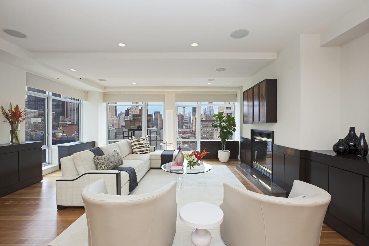 426 58th St W PH-4 New York, New York Penthouse Condominium Loft with three outdoor terraces, floor-to-ceiling windows, high ceilings and cherry hardwood floors! A keyed elevator opens onto a large gallery with warm southern light and open city views, leading to a home with a perfect layout, beautiful finishes and a sophisticated aesthetic. This oversized 3 bedroom and 2.5 bathroom (2,615sf) stunning full floor loft has it all with 4 exposures, 3 terraces, and many oversized windows with electronic shades, Miele washer/dryer, custom closets, and private storage. Massive Chef's kitchen with terraced breakfast area and an enormous and open entertaining living/dining room (20' x 33'). The gracious master suite boasts two exposures, a south-facing terrace and a windowed bath with stall shower and soaking tub. 426 West 58th Street is a boutique doorman condo which offers loft-like living uptown and is located at the crossroads of 'Billionaires' Row', Columbus Circle, Central Park, Lincoln Center, and The Shops at Time Warner including Whole Foods and Equinox. Amenities include a recently renovated lobby, 24hr concierge, fitness room, common courtyard and private storage. Pet friendly. This is an exceptional property with an abundance of light and air, unlike anything on the market!