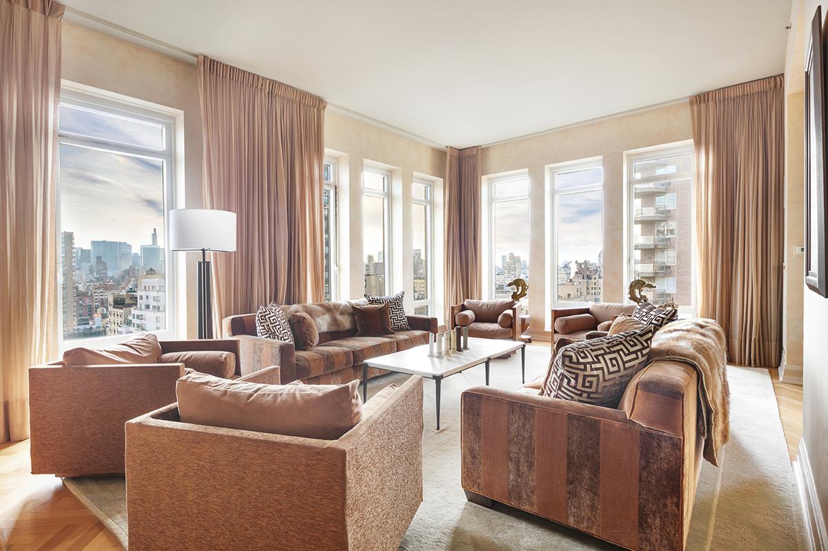 205 E 85th St PH-2CD New York, New York Live in this penthouse ranch in the sky, perched atop a full-service condominium located in prime Upper East Side. Approximately 6000 sq. ft. (542 sq.m.) this residence boasts an expansive gallery that seamlessly connects four fully incorporated areas: the entertaining and living spaces, the master suite, secondary bedroom suite, and a guest suite. A sprawling entertaining wing with south, east and west exposures includes a corner living room with gas fireplace, dining room, corner lounge/den with a gas fireplace, windowed breakfast kitchen with a center island, a study/library, a guest powder room, and staff room with bath. Across the hall are private quarters with three bedrooms and two full baths. The northeast wing features the enormous master suite with a gas fireplace, spacious dressing area, additional walk-in closets and sumptuous marble master bath with separate shower and tub. Northwest is the guest suite with a large marble bath and walk-in closets. Other apartment amenities include 11 ft. ceilings, hardwood floors, oversized windows, open city views, and an in-unit laundry room with additional service entrance. Co-Exclusive.