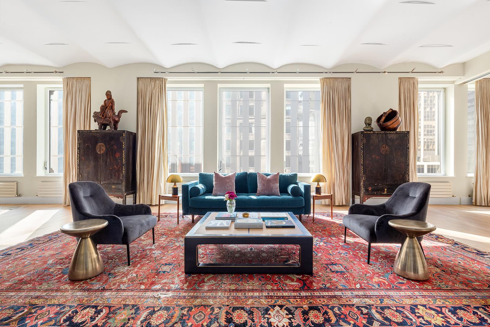 114 Liberty St 7 New York, New York Welcome to your keyed-elevator, voluminous and timeless, 14-room family sized, 5400 square foot full floor home. This home offers a contemporary fully equipped kitchen, five ultra-grand bedrooms, four luxuriously appointed bathrooms and one powder, plus corner library, windowed sitting or media room, windowed breakfast room, separate home-gym and private laundry. The residence includes pristine hardwood floors throughout, dramatic 12-foot ceilings throughout, quadruple exposures, architecturally significant cast iron columns and barrel-vaulted ceilings in Living and Dining, ultra-private foyer and keyed elevator. The home is outfitted with Nest thermostats, smart lighting system, is fully wired with speakers throughout and has key-less entry. From entry to exit, the home exudes an enchanting and ultra-chic downtown allure and personality all to its own.Two keyed elevators open into the private huge foyer adorned with enormous walk in storage closet, followed with your massive double doors which open to the 5400sf exquisite home. Upon passing the entrance, the volume is beyond breathtaking with its sheer size of over 70 linear feet along the entire Northern expanse, mile high ceilings and wall of extra-quiet noise abated new windows. The living room and corner library graciously and effortlessly flow into an expansive, open-concept dining and kitchen areas perfect for both intimate and grand family gatherings. The enormous chefs kitchen is equipped with an eat-in island and peninsula, custom cabinets and lighting and a suite of high-end stainless-steel appliances2 Miele dishwashers, Subzero Fridge, 6-burner Viking Stove and 2 Viking ovens plus and walk in pantry. Adjacent to the chefs kitchen is a windowed breakfast room and powder which leads to the large home gym.From the Living Room to bedroom suites, the depth expands over 115ft. Following the extra wide corridor, lies your Eastern facing sitting room with double French doors, five-bedroom suites and extra-large walk in laundry room with new LG washer and Samsung dryer. At the end of the corridor, lies the Master and Secondary suites, both gargantuan in portions, both with en-suite baths. The secondary super sweet bedroom is bright and airy with a wall of closets and en-suite Jack and Jill full bath. The glamorous Southeast Corner Master suite is the definition of the Grand Master. There are a pair of walk in closets and an exquisite windowed en-suite bath featuring beautiful double vanity, Jacuzzi bathtub and separate glass encased steam shower.The CondoSupremely located in the historic and charming Financial District, 114 Liberty is the epitome of authentic Downtown New York chic, with modern charm and effortless luxury living. Built in 1913 and served as a prestigious lighting factory, 114 Liberty was transformed into full floor Loft-like Residences in 1998 offering an ingenious combination of sublime iconic architecture with timeless modern interiors. 114 Liberty became the sought-after residential boutique Condo project and is comprised of a mere 11 floors, only 12 residences and two keyed-elevators located at heart of the World Trade Center making this an ultra-unique and coveted opportunity to own 5400sf in the heart of lower Manhattan.